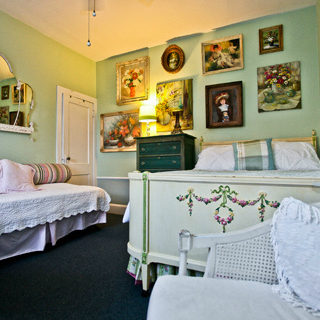 A picture of the bedroom with white furniture